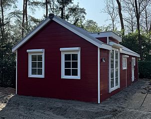 Charming red bungalow for sale in Markelo, Twente, located amidst the serene nature of Overijssel.